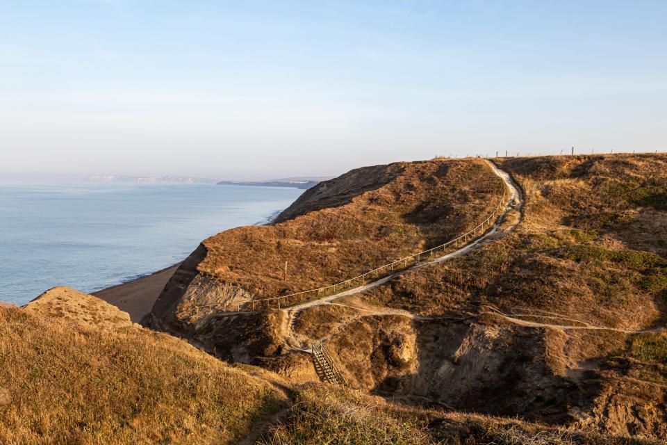 2CC7598 Footpaths leading down to the beach, at Shepherds Chine on the Isle of Wight, on a sunny summers morning