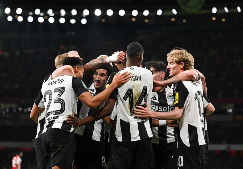 Newcastle United players celebrating a goal.