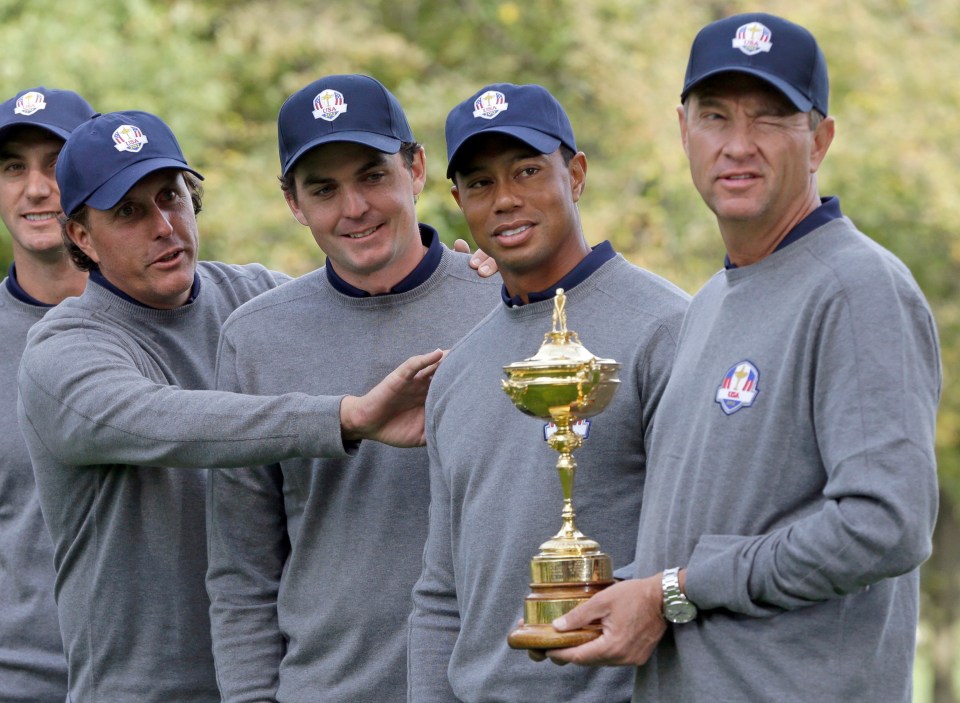 Four US Ryder Cup golfers with the trophy.