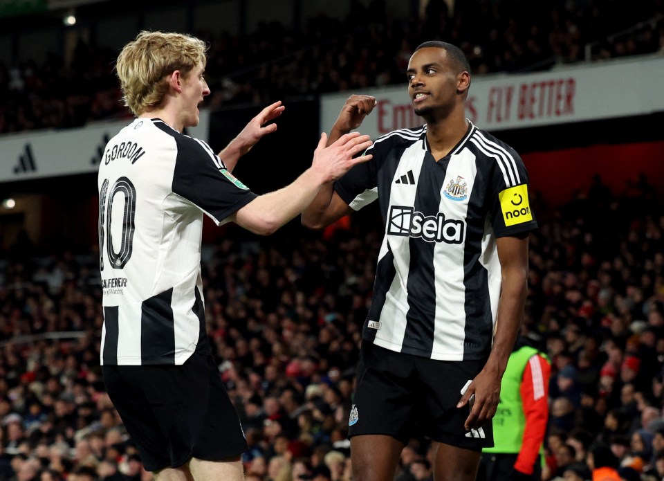 Alexander Isak of Newcastle United celebrates a goal with Anthony Gordon.