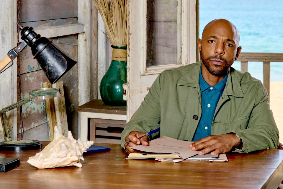 Man reviewing documents at a desk.
