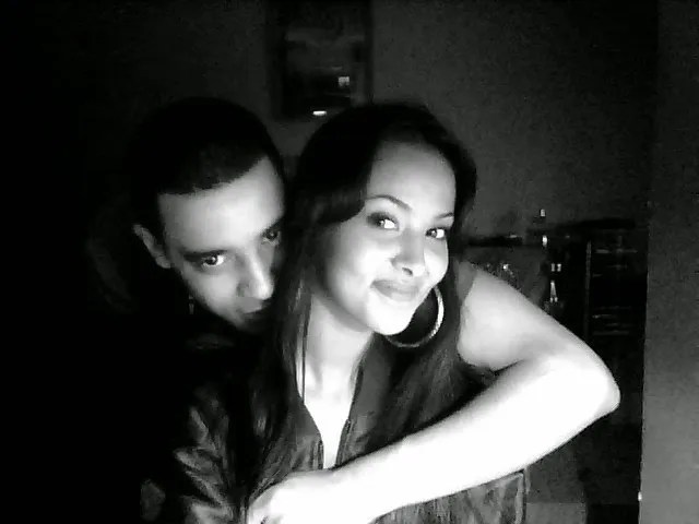 Black and white photo of a couple embracing.
