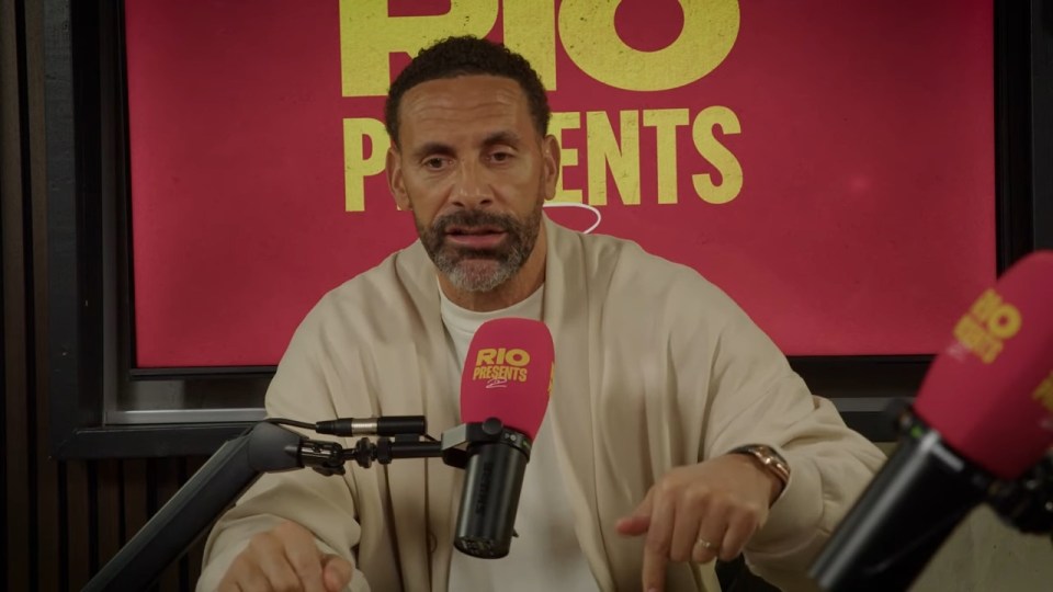 Rio Ferdinand speaking into a microphone.