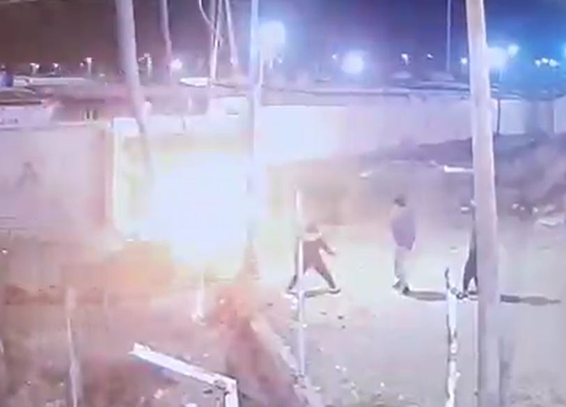 Explosion near people at night.