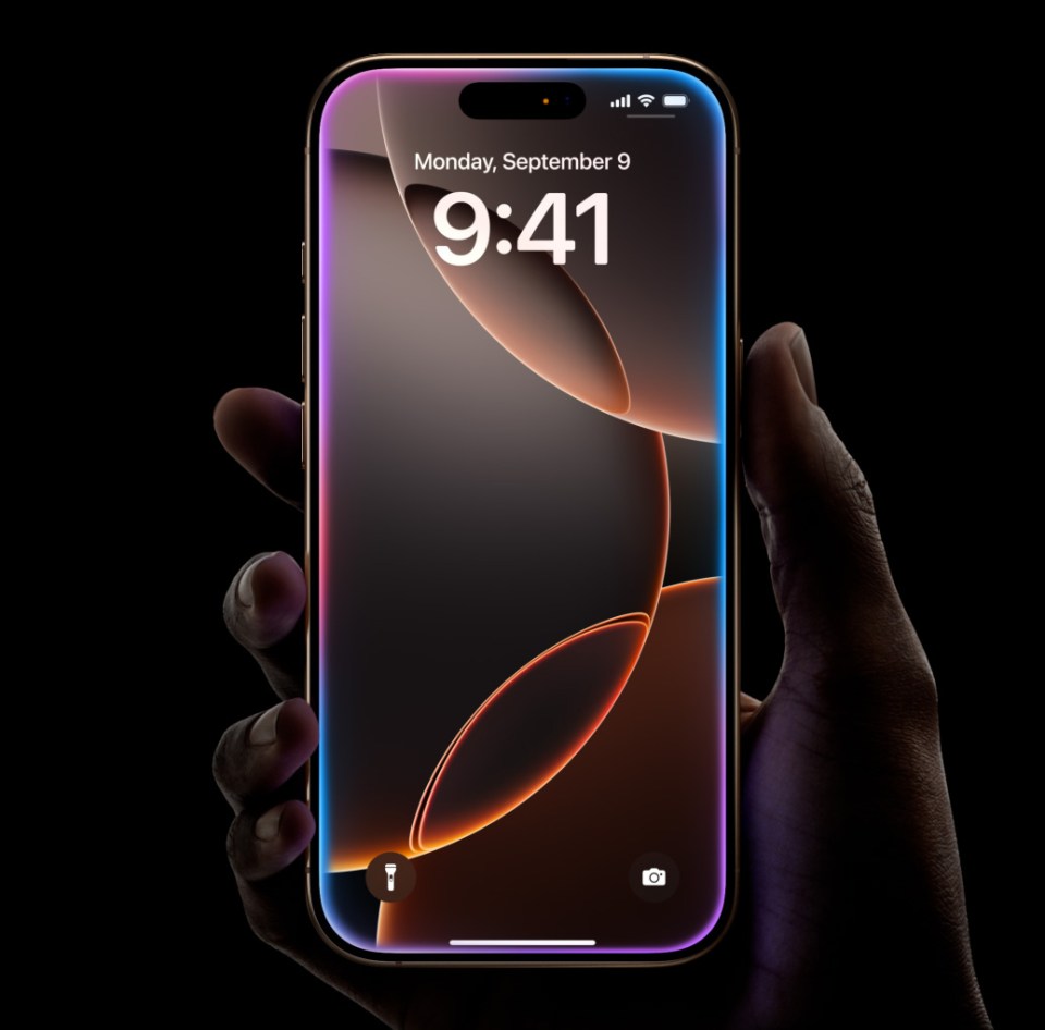 Hand holding iPhone with illuminated edges.