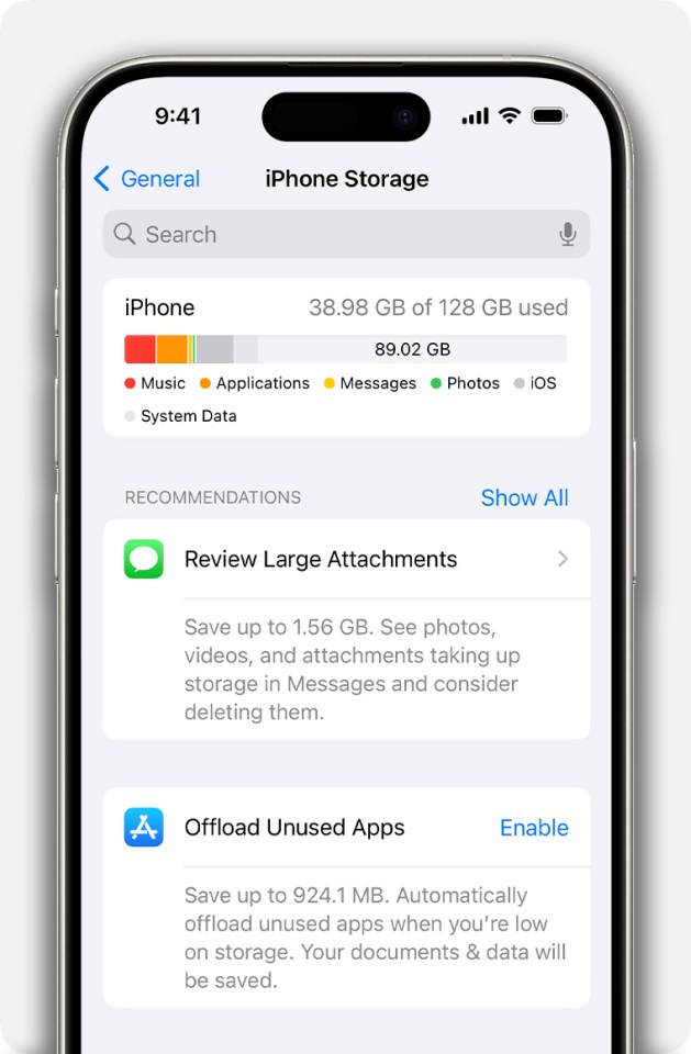 iPhone storage screen showing 38.98 GB of 128 GB used, with recommendations to review large attachments and offload unused apps.