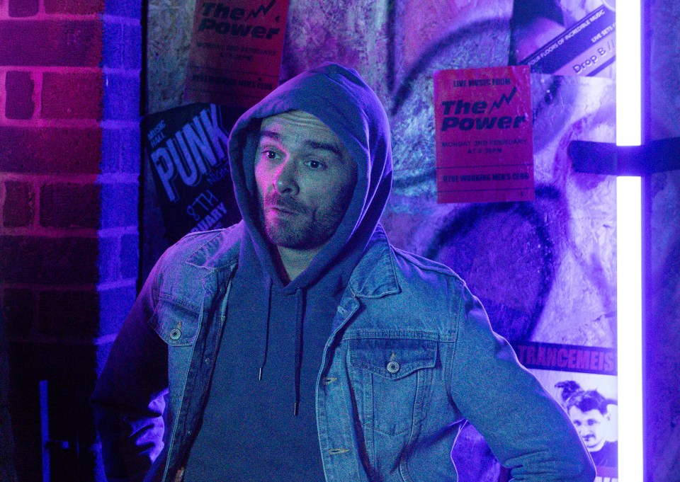David Platt, Coronation Street character, in a denim jacket and hoodie.