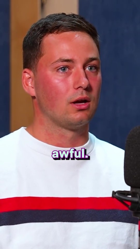Man saying "awful" into a microphone.
