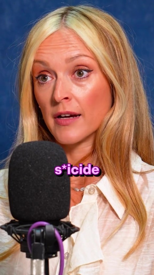 Woman speaking into microphone; the word "suicide" is superimposed.