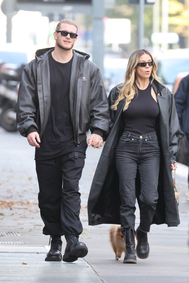 Loris Karius and Diletta Leotta holding hands while walking.