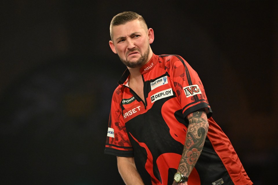 Nathan Aspinall at a darts match.