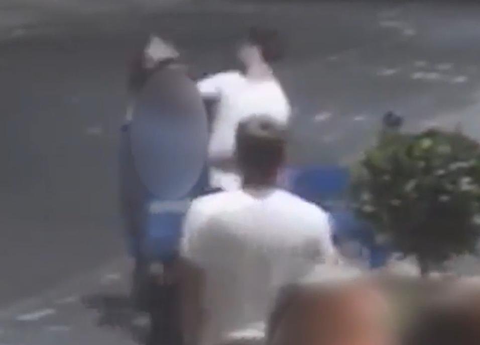 CCTV footage of a man punching another man.