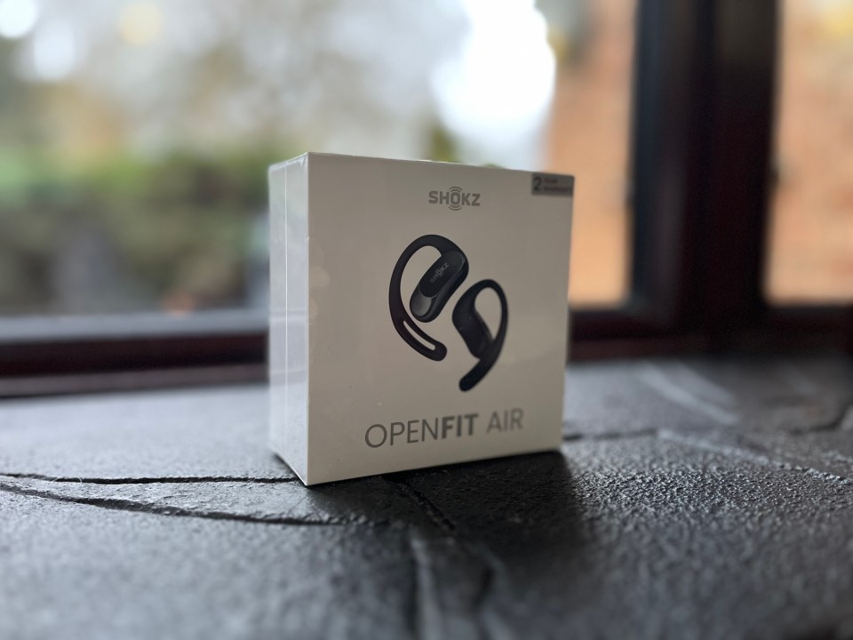 Shokz OpenFit Air earbuds in their box.