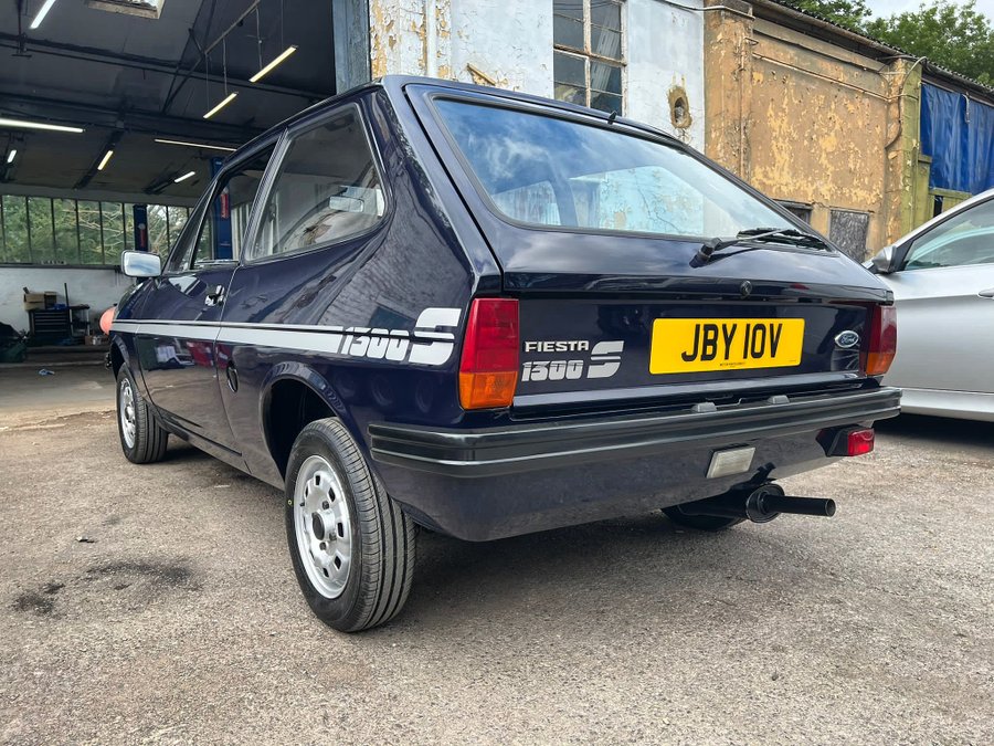 Rear view of a dark blue Ford Fiesta 1300S.