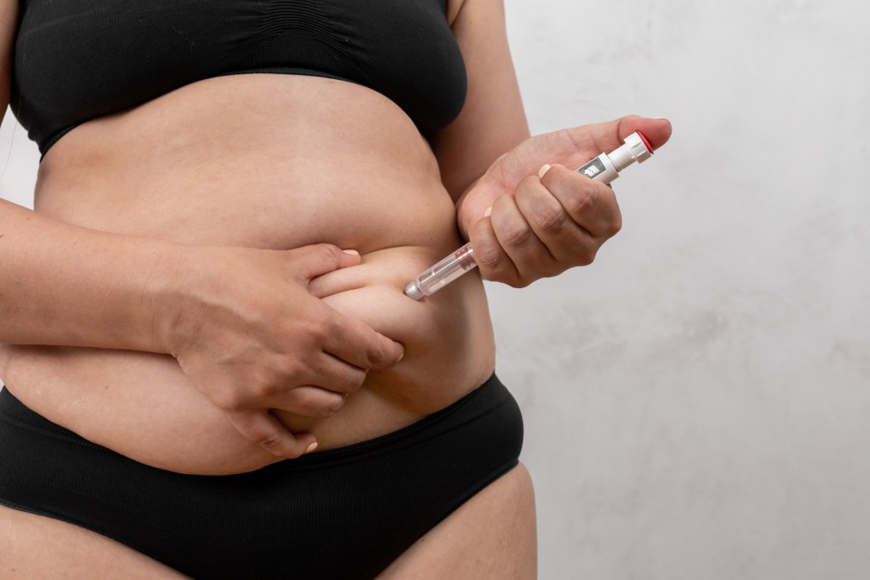 Woman self-administering semaglutide injection.