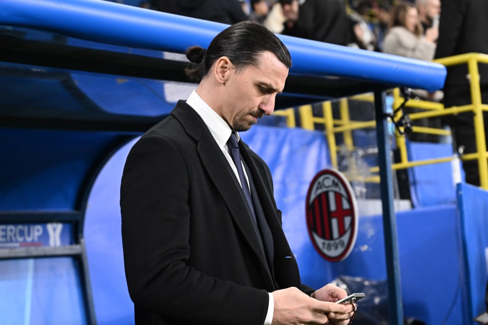 Zlatan Ibrahimovic of AC Milan on his phone during a soccer match.