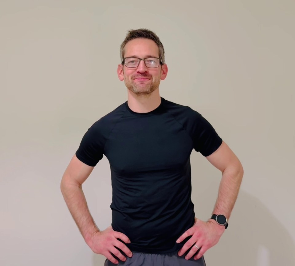 Man in black shirt and glasses.