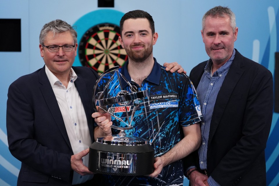 Luke Humphries with his trophy after winning against Jonny Clayton in the final of the 2025 Winmau World Masters at the Marshall Arena, Milton Keynes. Picture date: Sunday February 2, 2025. PA Photo. See PA story DARTS Masters. Photo credit should read: Bradley Collyer/PA Wire. RESTRICTIONS: Use subject to restrictions. Editorial use only, no commercial use without prior consent from rights holder.