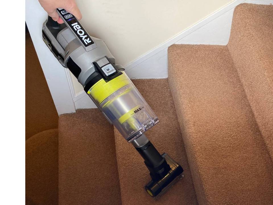 The Ryobi One+ stick vacuum in handheld mode