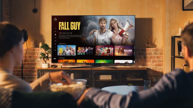 Couple watching Now TV on their television.