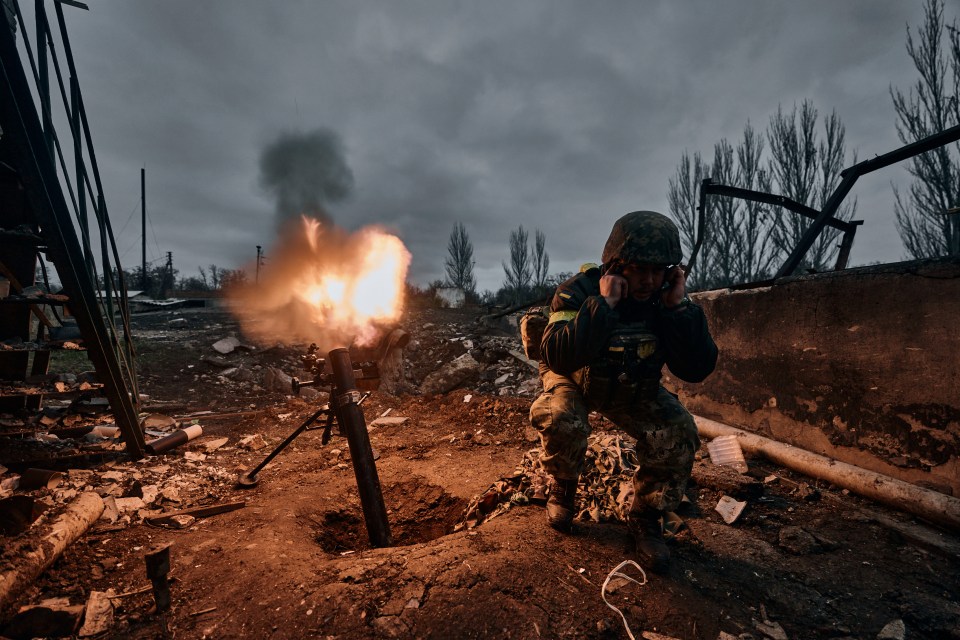 FILE - A Ukrainian soldier fires a mortar at Russian positions in Bakhmut, Donetsk region, Ukraine, Thursday, Nov. 10, 2022. A top adviser to Ukraine's president has cited military chiefs as saying 10,000 to 13,000 Ukrainian soldiers have been killed in the country's nine-month struggle against Russia's invasion, a rare comment on such figures and far below estimates of Ukrainian casualties from Western leaders. Late Thursday, Dec. 1, 2022, Mykhailo Podolyak, a top adviser to Ukrainian President Volodymyr Zelenskyy, relayed new figures about Ukrainian soldiers killed in battle, while noting that the number of injured troops was higher and civilian casualty counts were significant. (AP Photo/Libkos, File)