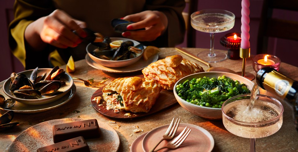 Romantic Valentine's Day meal with pastry, mussels, and vegetables.