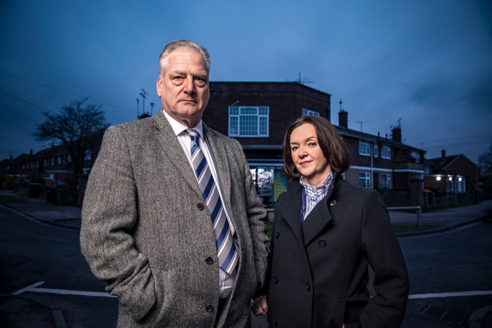 Photo of Carl Foster and Denise Brown standing outside at night.