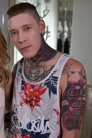 Headshot of a heavily tattooed man convicted of assaulting his girlfriend.
