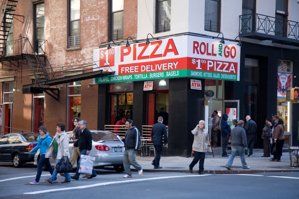 $1 pizza and roll shop on Broadway in Tribeca, New York City.