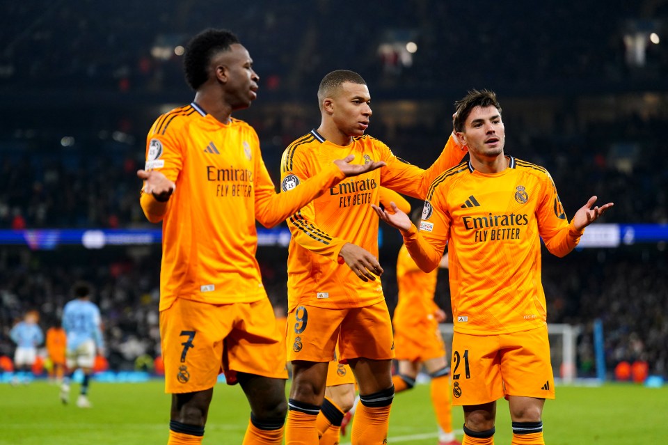 Real Madrid players celebrating a goal.