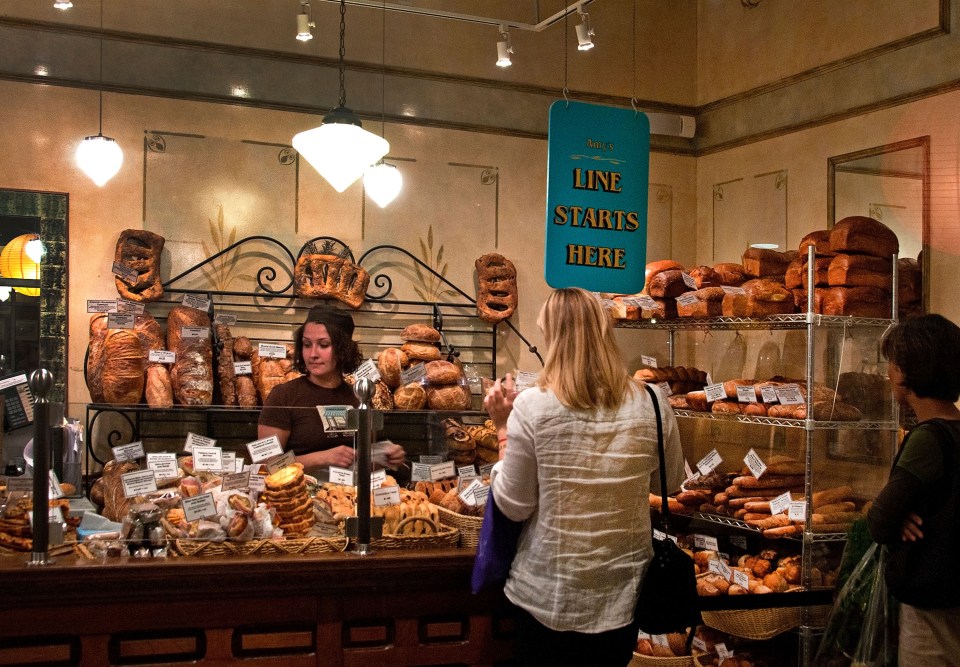Interior view of Amy's Bread bakery in Chelsea Market, showing various breads and pastries on display.