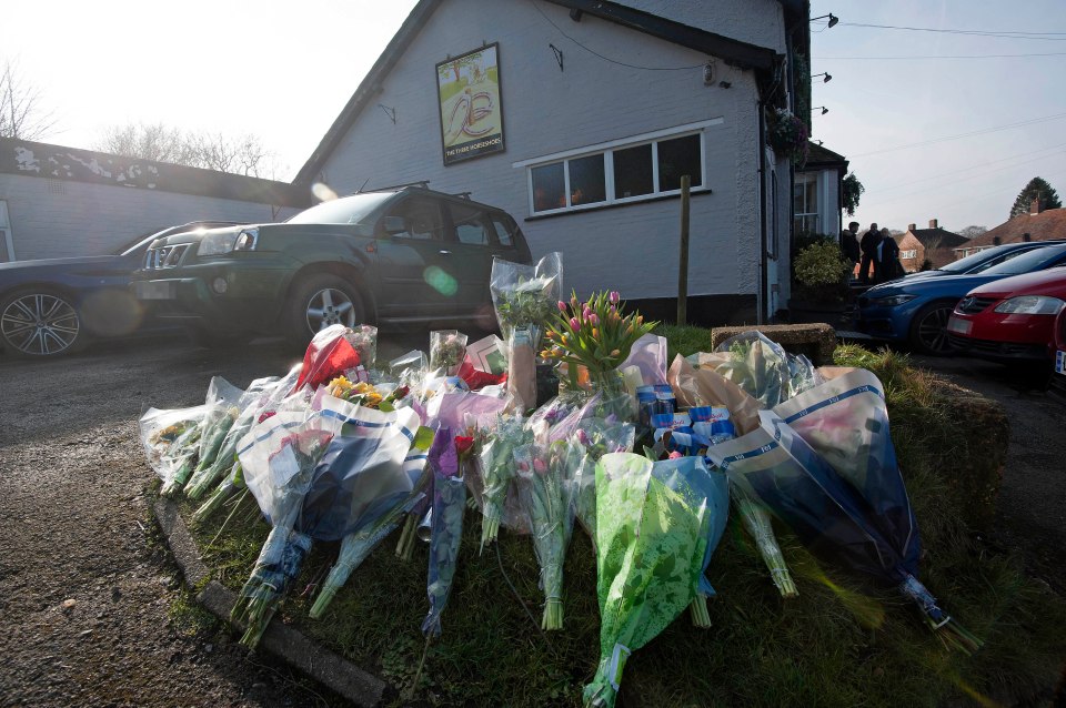 Flowers laid as a tribute outside a pub following a fatal shooting.