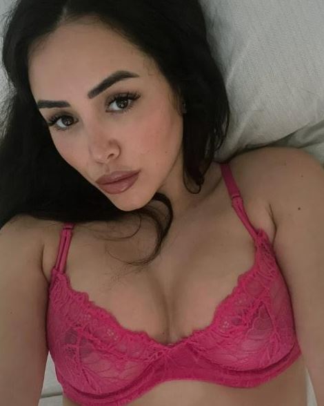 Marnie Simpson in a pink lace bra.