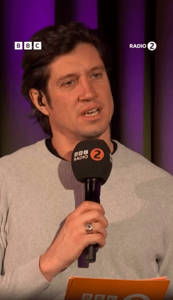 Man speaking into a BBC Radio 2 microphone.