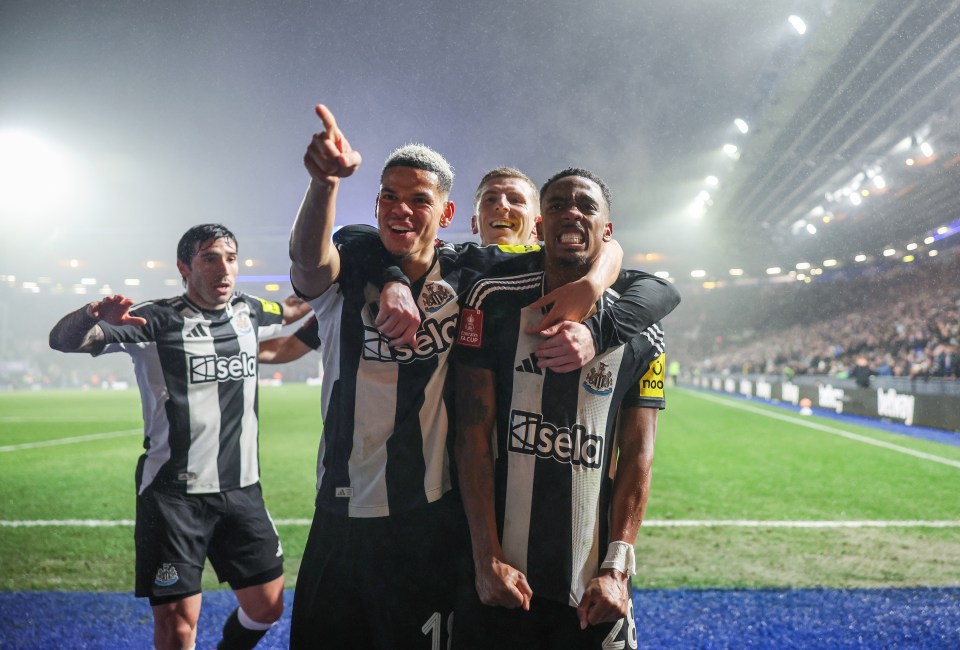 Newcastle United players celebrating a goal.