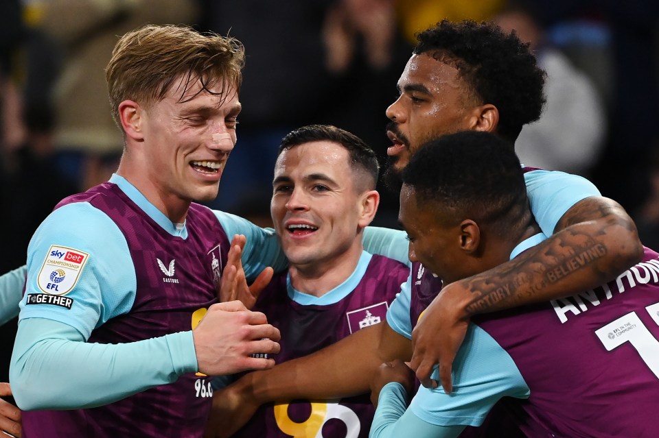 Burnley soccer players celebrating a goal.