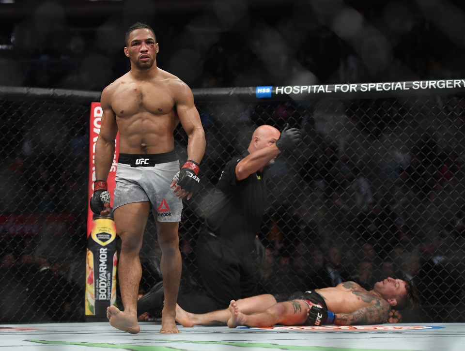 Kevin Lee (red gloves) defeats Gregor Gillespie in a UFC match.