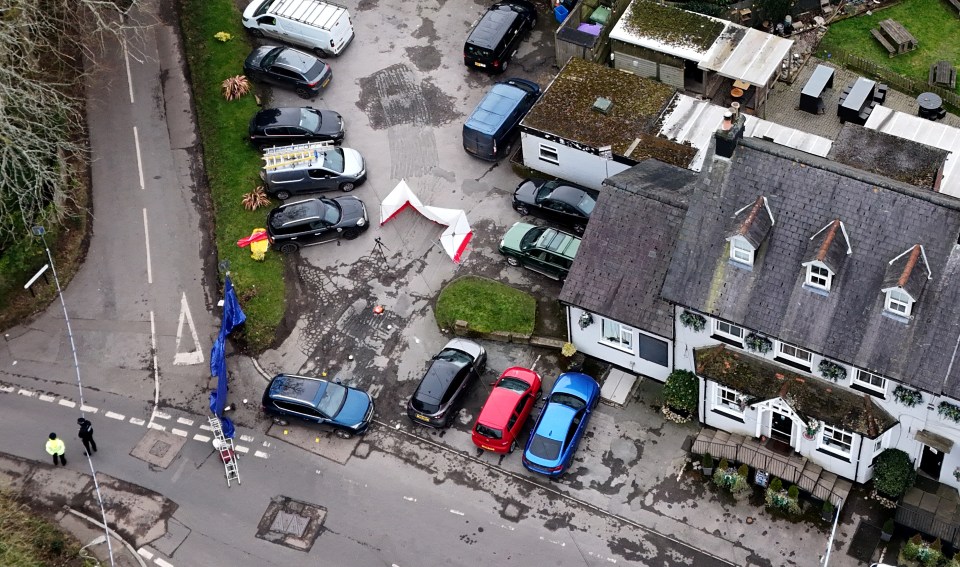 Aerial view of a police cordon surrounding the Three Horseshoes pub.