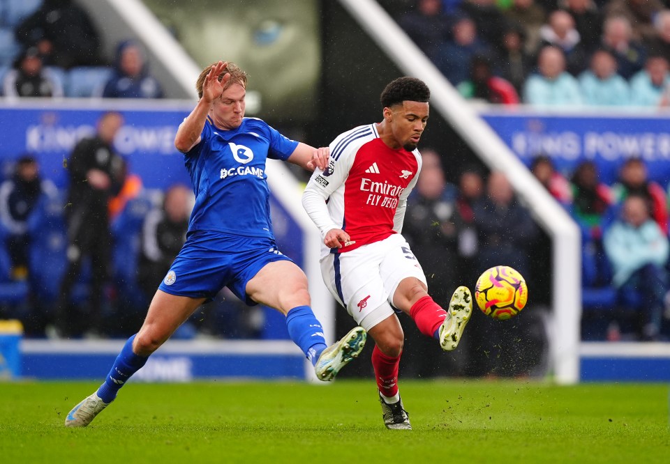 Leicester City's Victor Kristiansen and Arsenal's Ethan Nwaneri vying for the ball during a Premier League match.