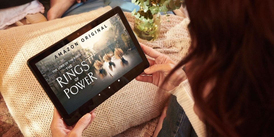 Person watching The Lord of the Rings: The Rings of Power on a tablet.