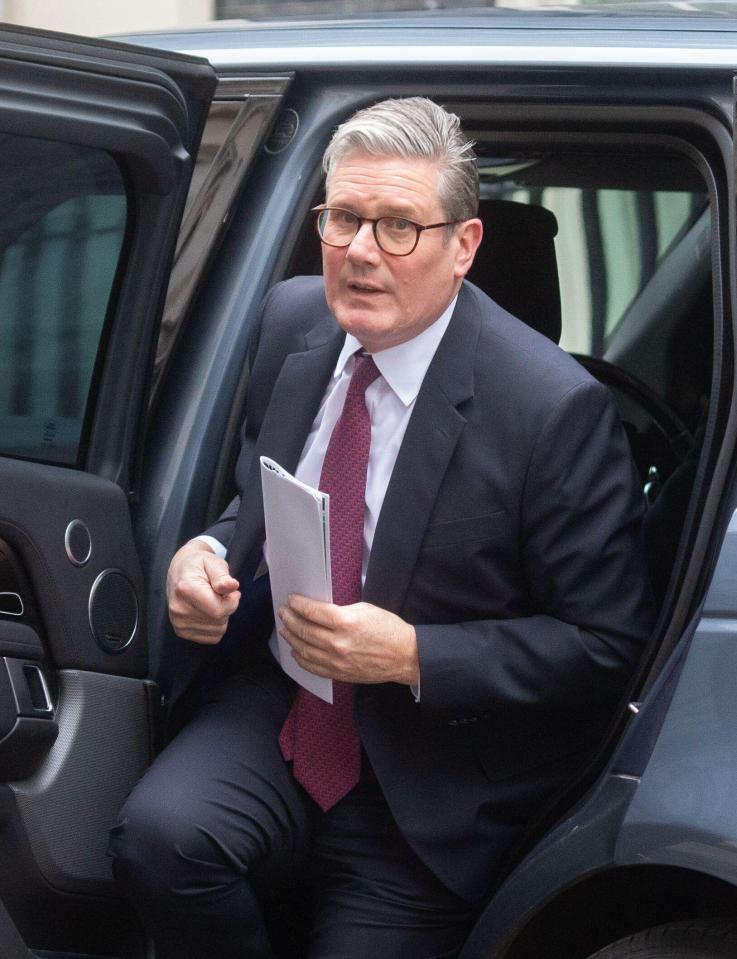 Keir Starmer exiting a car at 10 Downing Street.