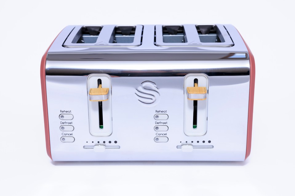 Four-slice toaster with reheat, defrost, and cancel buttons.