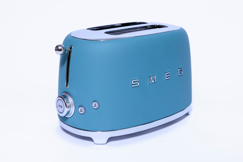Teal Smeg two-slot toaster.