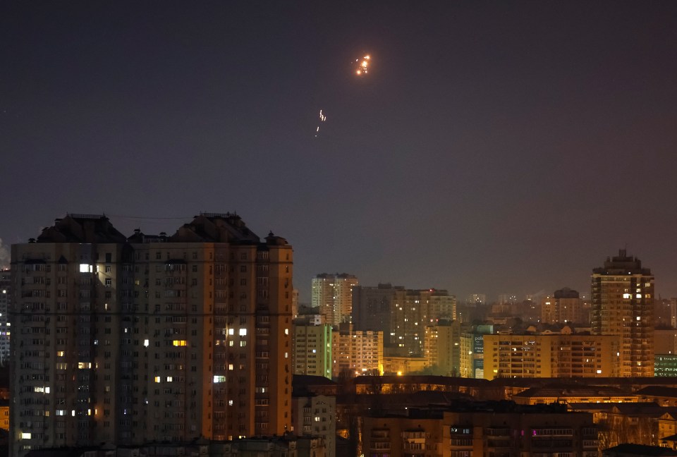 Explosions and tracers in the night sky over Kyiv.
