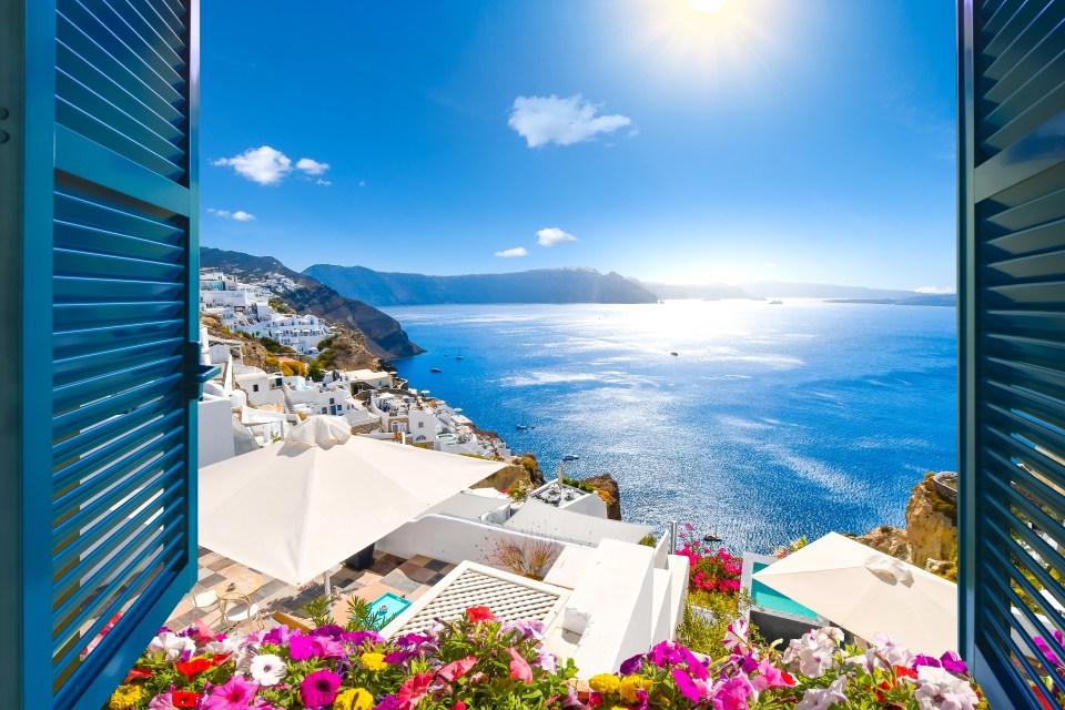 View from an open window of the Aegean Sea and Oia, Santorini.