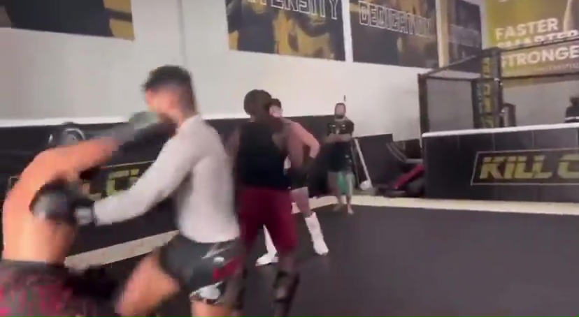 Kevin Lee being hit during a martial arts practice.