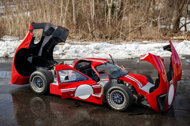 Refurbished 1967 Ford GT40 race car with its body panels open.