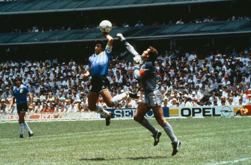 Diego Maradona scoring a goal during the 1986 FIFA World Cup quarterfinal match against England.