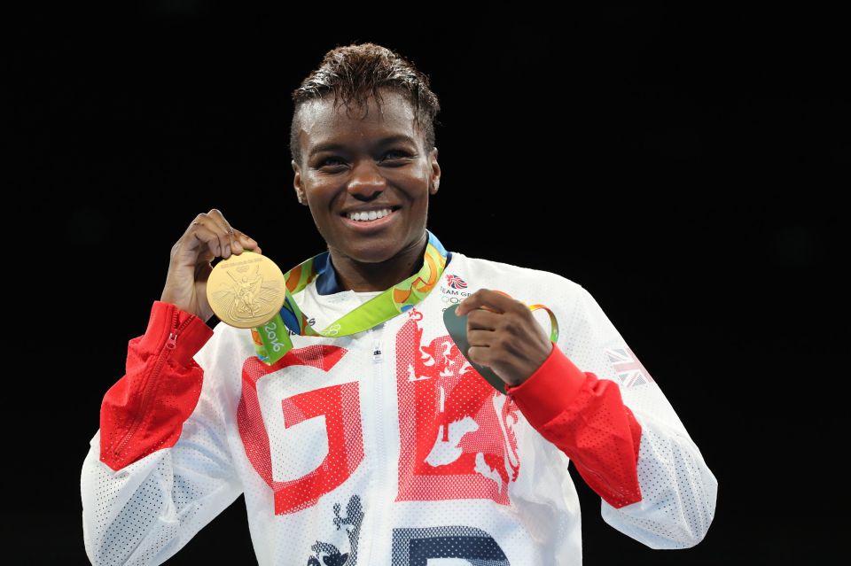 Nicola Adams holding two medals.