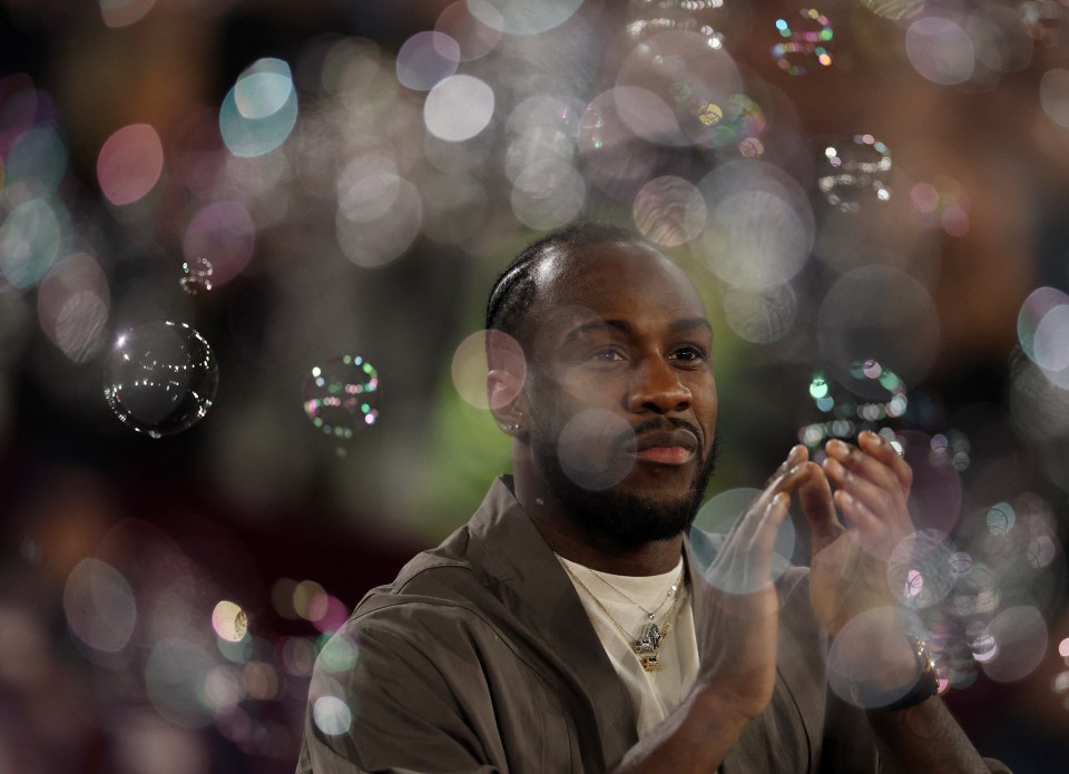 Michail Antonio applauding amidst soap bubbles.